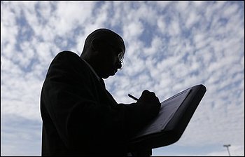 In this Sept. 25, 2009 photo, Melvin Winston fills an out application for positions at a new bar and restaurant in Detroit. The unemployment rate rises to 9.8 percent as employers cut more jobs than expected in September, evidence that the longest recession since the 1930s is still inflicting widespread pain. (AP Photo/Paul Sancya)